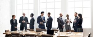 Business people around a table in the meeting space