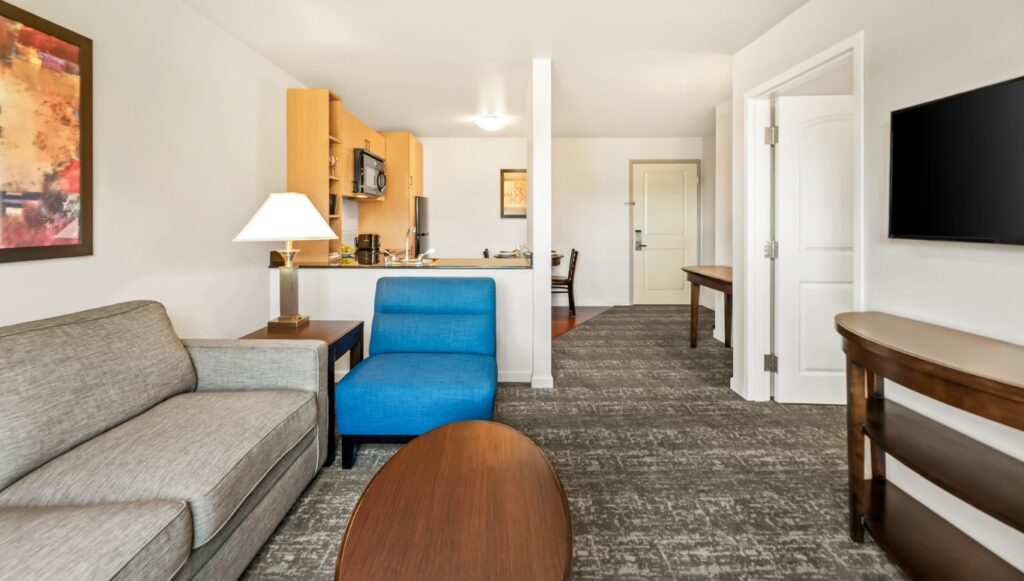 Ledgestone Hotel Yakima - 1 Bed Room - Living Space with Kitchen in Background