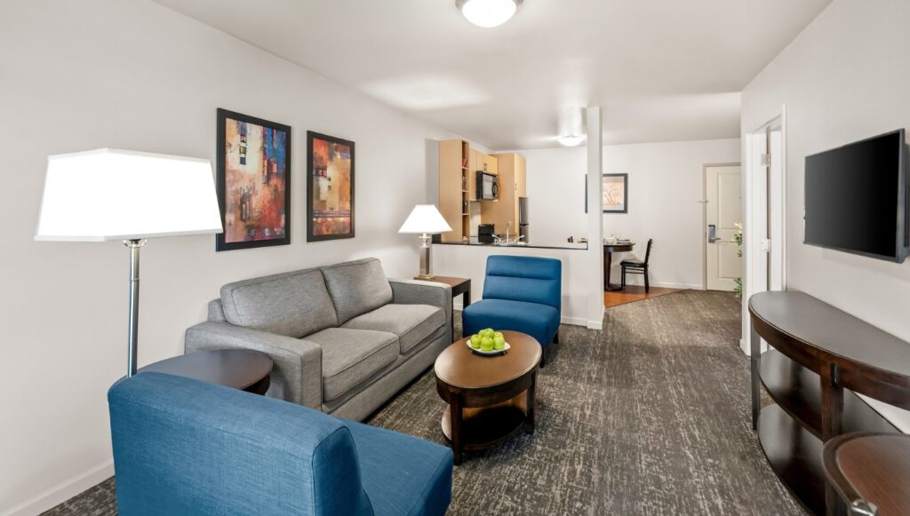 Ledgestone Hotel Yakima - 2 Bed Room - Living Space with Kitchen in Background