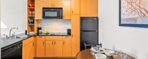 Extended Stay Hotel Room Kitchen and dining table at Ledgestone Hotel Yakima