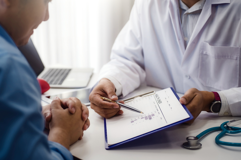 Doctor showing a patient a chart
