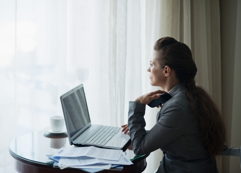 Woman working remotely in a hotel